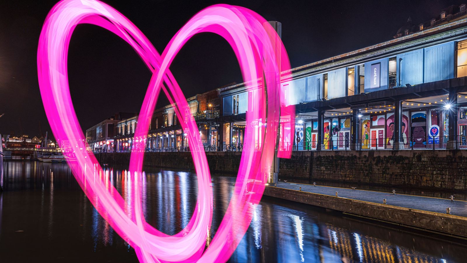 Bristol Light Festival pink 'light painted' heart in front of Harbourside bars