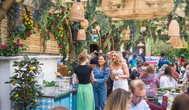 Racks summer event with people on terrace