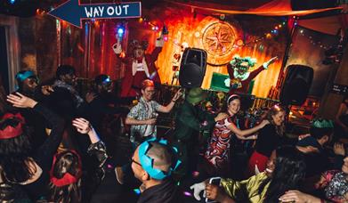 People partying and doing a conga