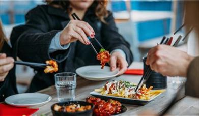 People eating with chopsticks