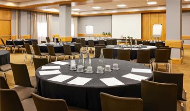 Novotel conference room set up with round tables