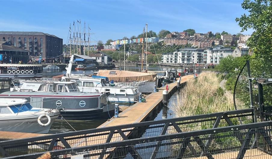 A row of boats moored in Bristol Harbour.