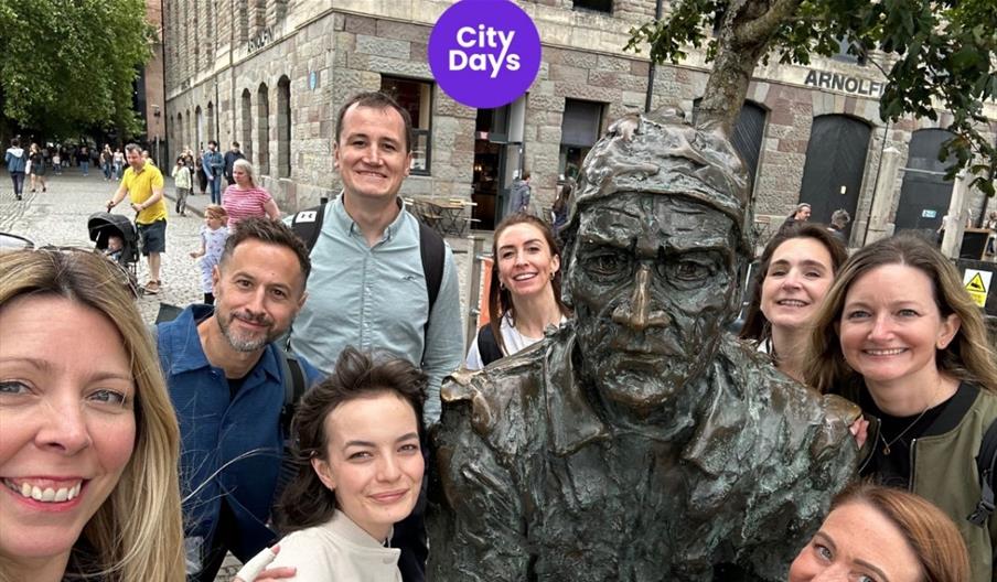 City Days group shot with statue on harbourside