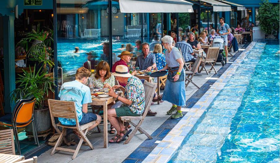 People enjoying a meal on the terrace at Bristol Lido