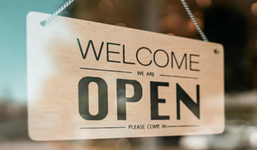 welcome sign in a window