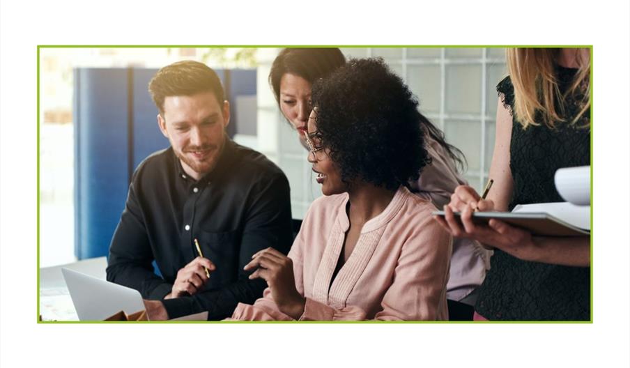 People talking while looking at a screen