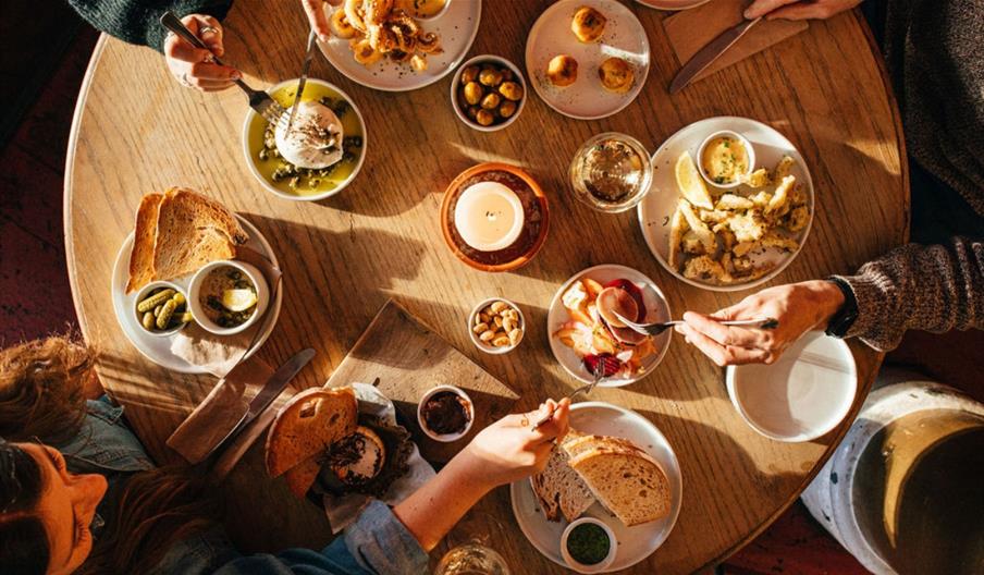Plates of food on a table at the No.1 Harbourside restaurant in Bristol.