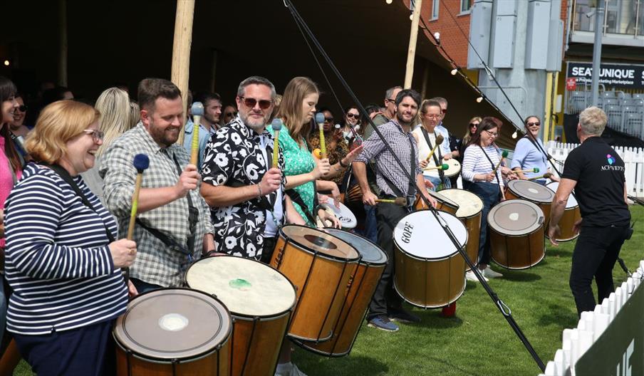 Team building group drumming
