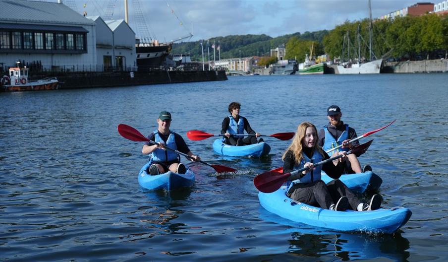 People kayaking in Bristol harbour