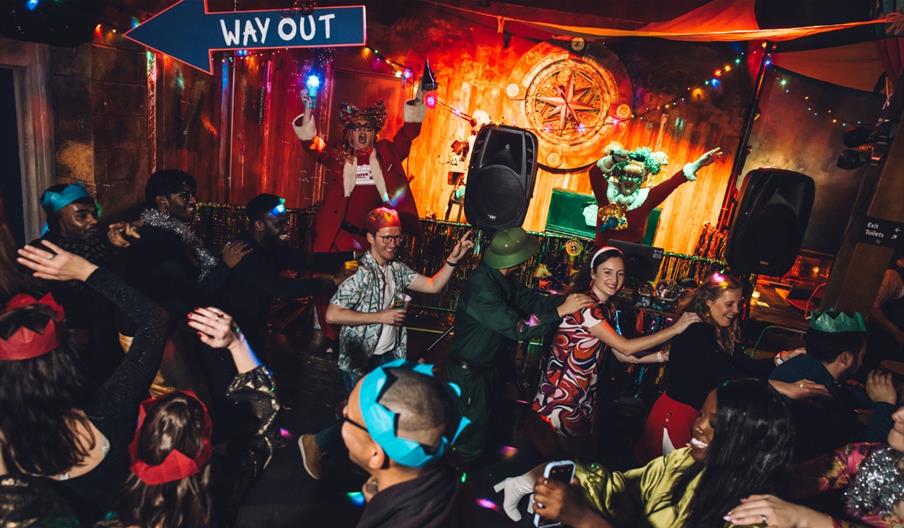 People partying and doing a conga