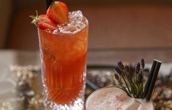 Two cocktails on a table top