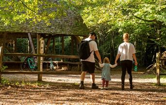 Family walking in woods