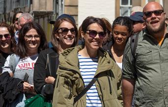 Luke leading a tour with people laughing and enjoying the Blackbeard to Banksy tour