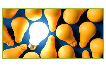 stock photo of lightbulbs, only one of which is illuminated