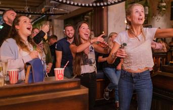 Group of people playing Darts