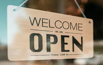 welcome sign in a window