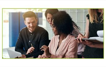 People talking while looking at a screen