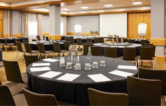 Novotel conference room set up with round tables