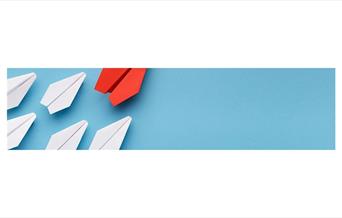 Paper airplanes on a blue background
