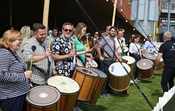 Team building group drumming