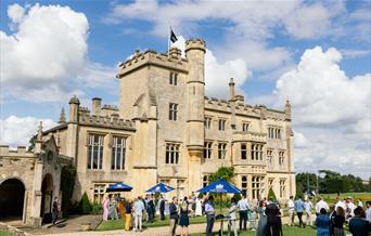 Exterior of Farleigh House, people gathered in the Garden