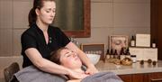 A practitioner performing a massage treatment at the Royal Crescent Hotel & Spa in Bath