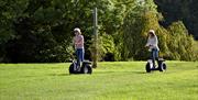 Two people on segways