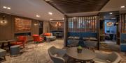 Tables, chairs- hotel lobby meeting area