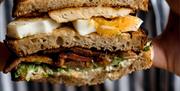 A club sandwich served at No.15 Bath, GuestHouse Bar
