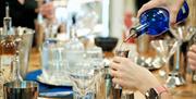 Person making cocktails