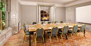 Conference room with large table and screen