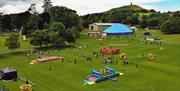 Image of field with inflatable assault course