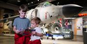 Children with leaflet at Aerospace Bristol