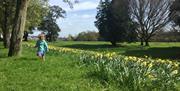 Child running in garden at Ashton Court Estate