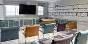 Conference room in theatre style with a TV at the Aztec
