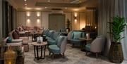 Relaxing lounge with low lighting and seating