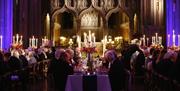 Bristol Cathedral people seated for dinner