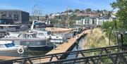 A row of boats moored in Bristol Harbour.