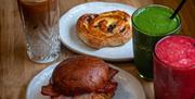Breakfast options at The Granary - bacon roll, pastry and smoothies