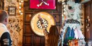 Women playing Darts