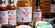 Close-up shot of bottles of sauce and jars of eggs