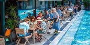 People enjoying a meal on the terrace at Bristol Lido