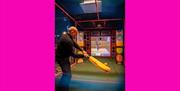 Someone in one of the batting cages at Sixes