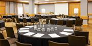 Novotel conference room set up with round tables