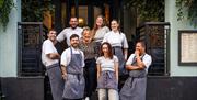 Chefs infront of Pizza on the Park