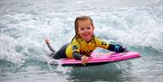 Child body boarding at The Wave Bristol