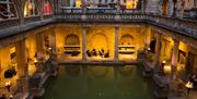 String quartet playing in Roman Baths by torchlight