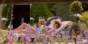 A woman lounging in the Spa at Lucknam Park in Thickwood, near Bath
