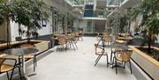 University West of England empty atrium tables and chairs