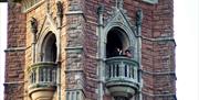 People looking out from balcony in Cabot Tower